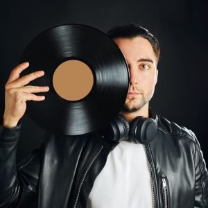 music-vinyl-record-man-holding-black-vinyl-record-2022-08-01-04-33-21-utc.jpg